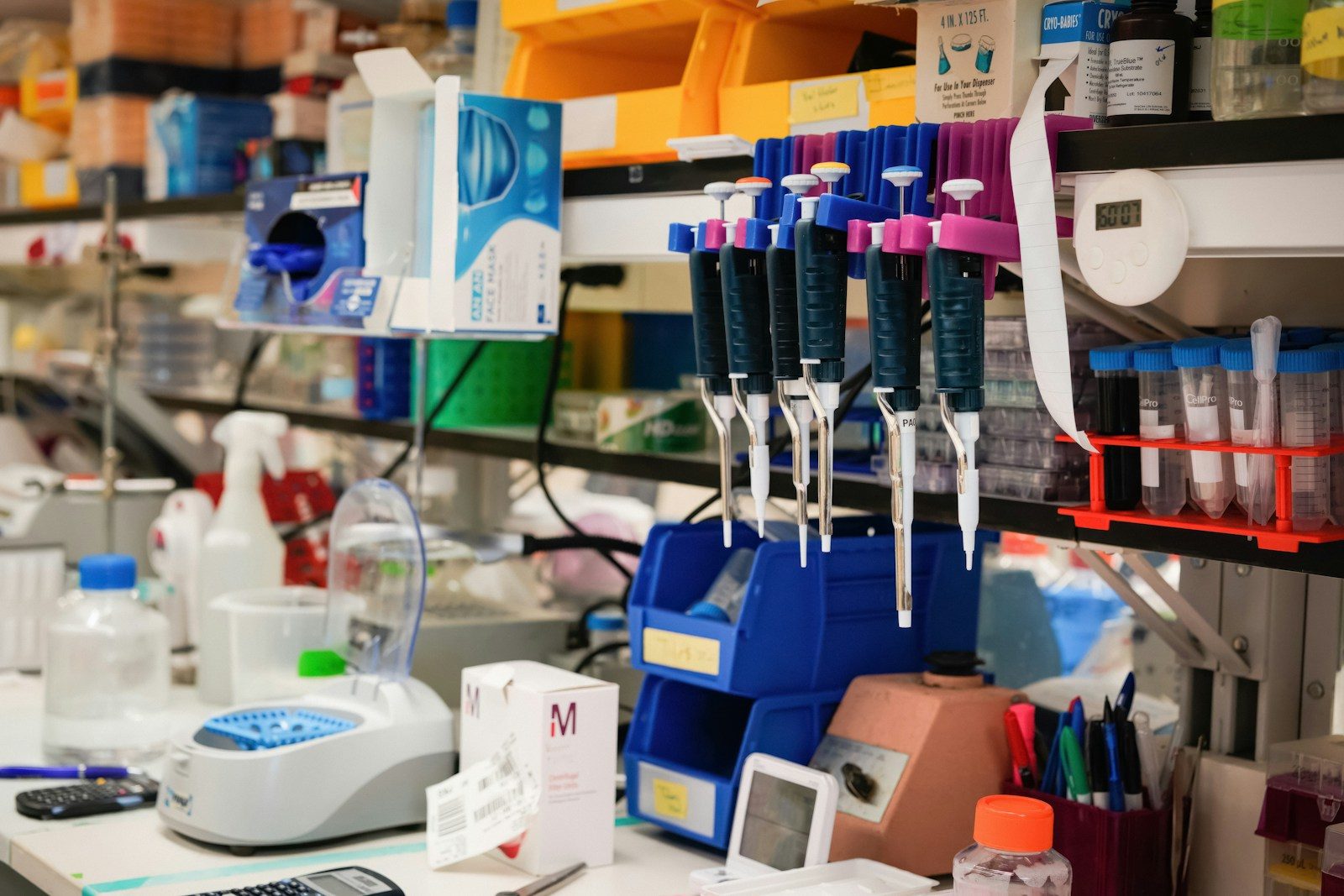 Lab bench with pipettes, reagents and sample racks