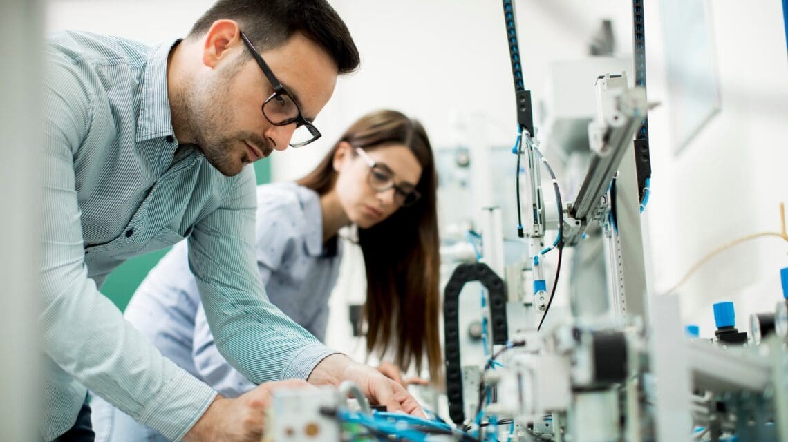Two scientists in an engineering laboratory