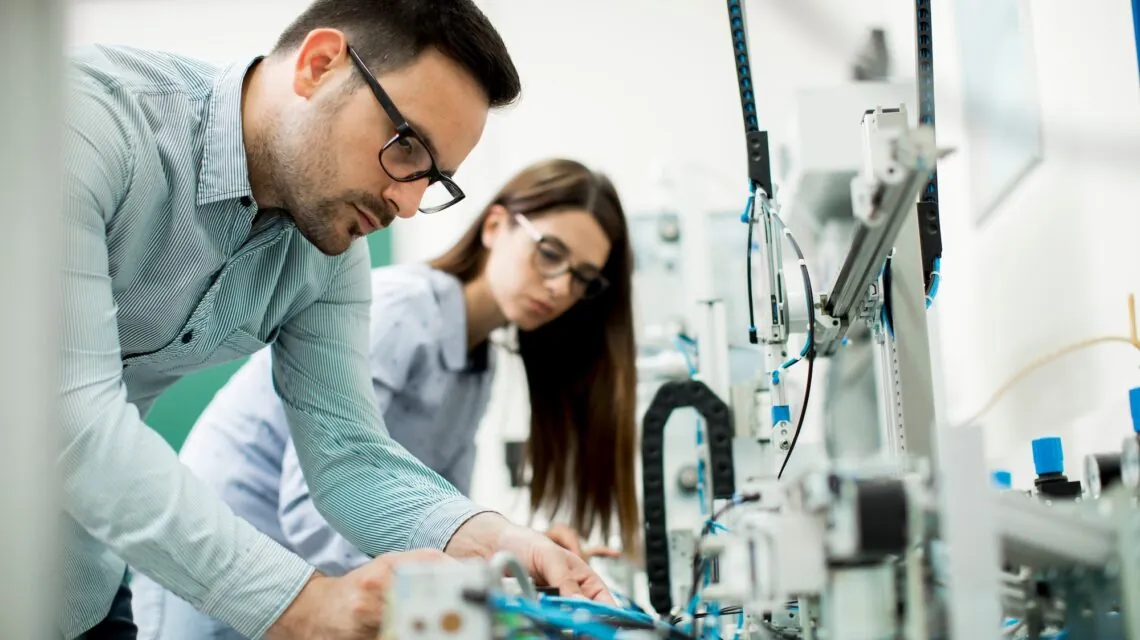 Two scientists in an engineering laboratory