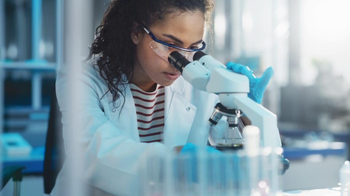 Woman looking in a microscope