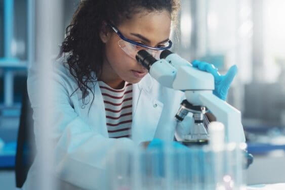 Woman looking in a microscope