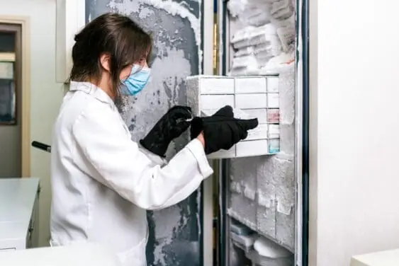 Woman working with lab cold storage