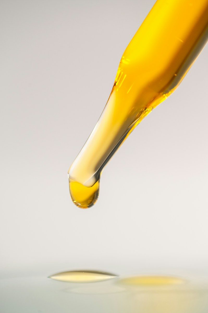 yellow and white glass bottle