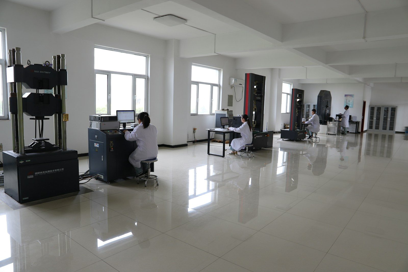 Materials testing laboratory with load frames and workstations