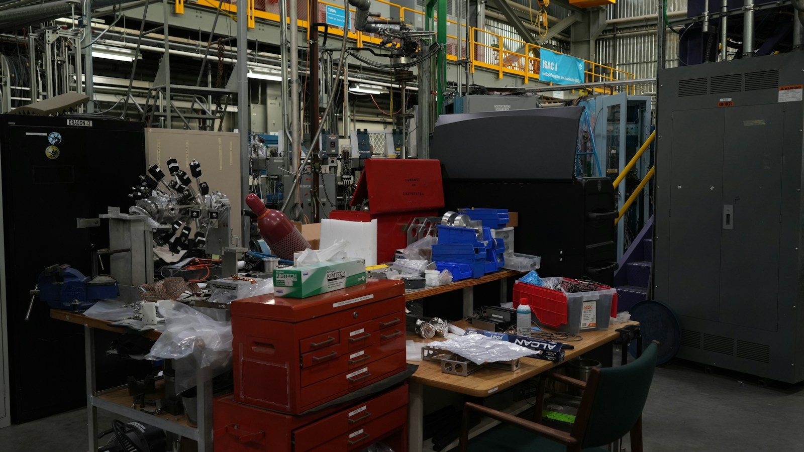 A cluttered workbench in a busy laboratory or workshop