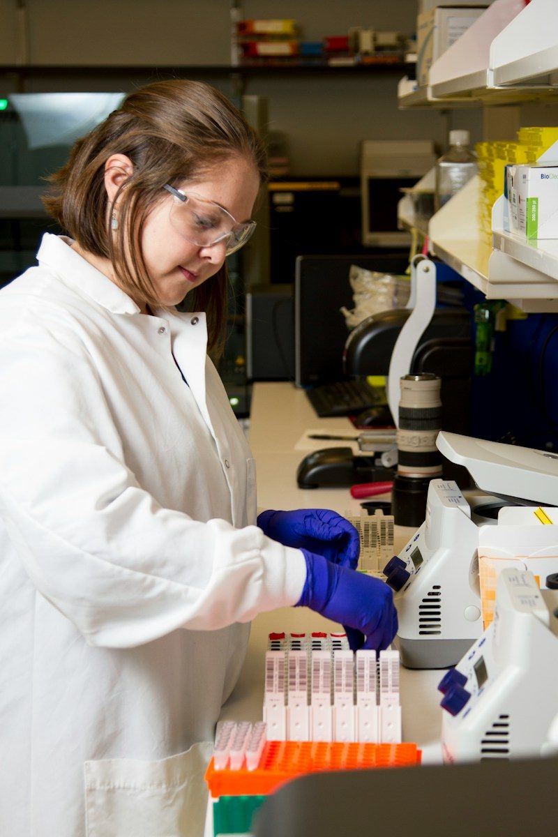 Researcher preparing sample tubes at a lab bench