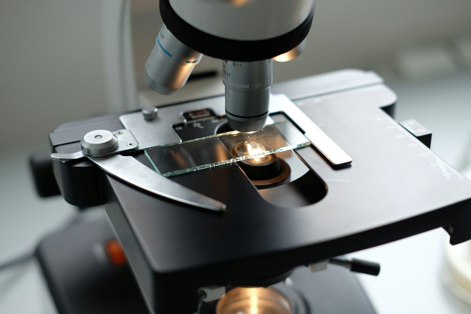 A microscope being used to examine a substance